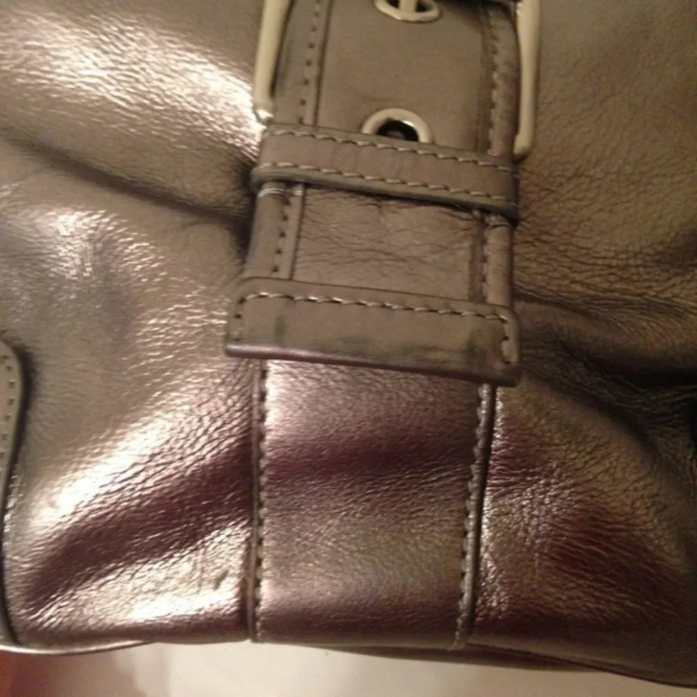 Michael Kors silver metallic hobo bag buckle
